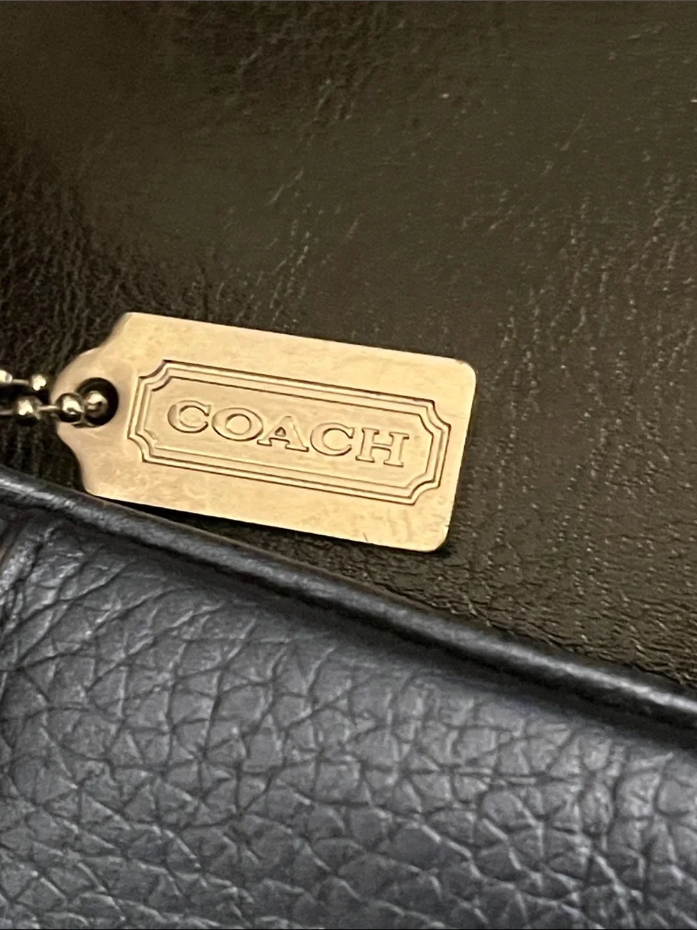 Metallic blue Coach crossbody purse